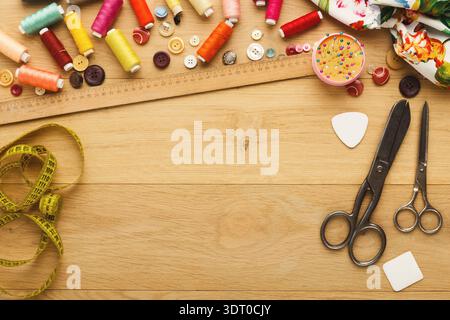 Crafting With Thread and Scissors in a Creative Space on a Wooden Table Stock Photo