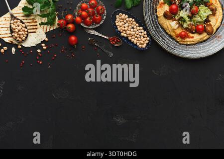 Food Collage With Various Ingredients Arranged on a Black Surface Stock Photo