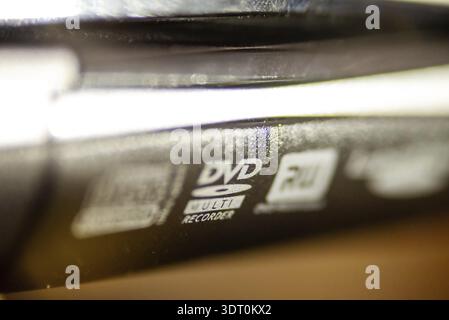 Dvd cd disk drive labels on laptop computer Stock Photo
