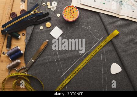 Collage of Sewing Tools and Materials for Creating Garments on a Workspace Table Stock Photo