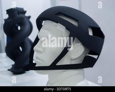 Protective helmet. Helmet printed on 3D printer from powder material. Model printed on 3D printer from melted polyamide powder. Multi Jet Fusion. Modern additive progressive 3D printing technology Stock Photo