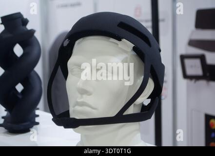Protective helmet. Helmet printed on 3D printer from powder material. Model printed on 3D printer from melted polyamide powder. Multi Jet Fusion. Modern additive progressive 3D printing technology Stock Photo