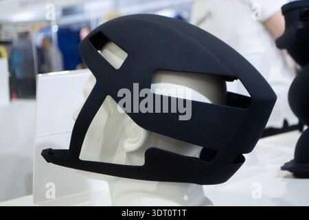 Protective helmet. Helmet printed on 3D printer from powder material. Model printed on 3D printer from melted polyamide powder. Multi Jet Fusion. Modern additive progressive 3D printing technology Stock Photo