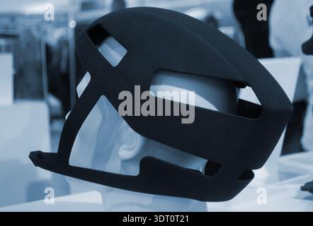 Protective helmet. Helmet printed on 3D printer from powder material. Model printed on 3D printer from melted polyamide powder. Multi Jet Fusion. Modern additive progressive 3D printing technology Stock Photo