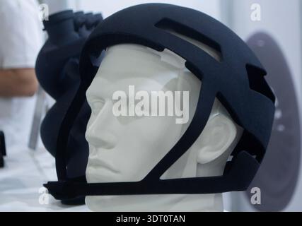 Protective helmet. Helmet printed on 3D printer from powder material. Model printed on 3D printer from melted polyamide powder. Multi Jet Fusion. Modern additive progressive 3D printing technology Stock Photo