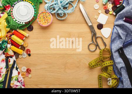 Creating a Colorful Collection of Sewing and Crafting Materials on a Wooden Table Stock Photo