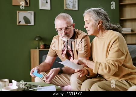 Senior Caucasian Man and Woman Reviewing Medical Instructions Together Stock Photo