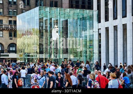 Shoppers crowd an Apple store in Shanghai to try the tech giant's first ...