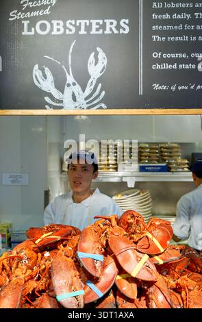 Lobsters are stacked at Lobster Place in Chelsea Market. Workers prepare fresh seafood daily for customers in Manhattan. Stock Photo