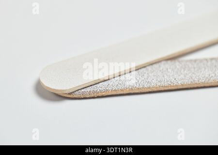 Emery board nail file close-up displaying an abrasive surface for nail care Stock Photo