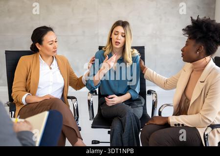 Business team having a meeting in office and solving problem. Teamwork, people and crisis concept. Stock Photo