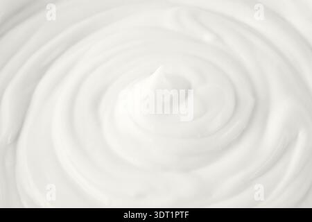 Cream, soft milk greek yogurt texture as background in trendy color of 2026 year Cloud Dancer. Stock Photo