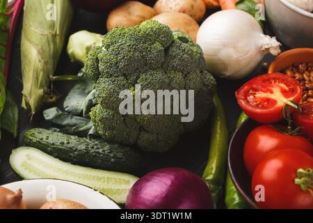 Collection of Fresh Vegetables Arranged on a Dark Surface Stock Photo