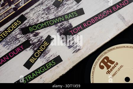 Close-up of 'Street Level - 20 New Wave Hits' LP album cover with vinyl record, top angle shot Stock Photo