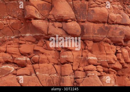Close up view of lumpy fractured red rock surface Stock Photo