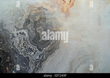 A textured background imitating marble with swirling patterns of gray, black, and subtle hints of beige. The abstract design adds elegance and complex Stock Photo