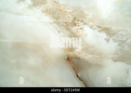 Elegant marble imitated texture in soft beige, cream, and white tones with subtle veins. Ideal for backgrounds, design projects, or interior mockups, Stock Photo