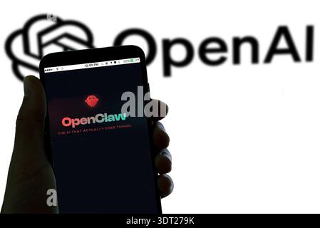 barcelona, Spain - 20 february 2026: the logo of Openclaw AI agent is seen on a smartphoe with the logo of Open AI in the background Stock Photo