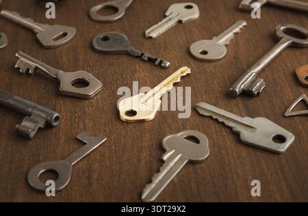 Unique Key Collage Shows Variety of Shapes and Sizes on a Wooden Background Stock Photo