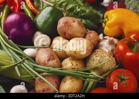 Collection of Assorted Vegetables Arranged in a Collage on a Dark Background Showing Fresh Produce Stock Photo