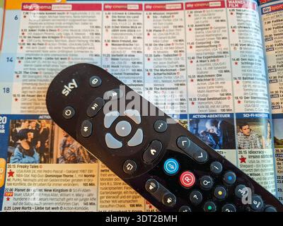 Sky Fernbedienung auf einer TV Zeitung *** Sky remote control on a TV newspaper Copyright: xLobeca/RalfxHomburgx Stock Photo
