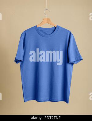 Cobalt blue t-shirt on hanger, cobalt beige wood palette, apparel mockup online shop, textile cotton texture, fashion backdrop Stock Photo