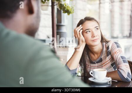 Meeting in a Cafe Where Two People Share Thoughts and Feelings Over Coffee in the Afternoon Stock Photo