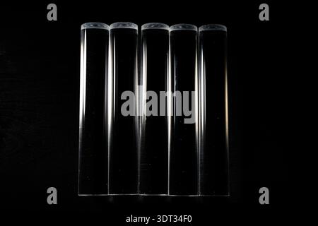 Clear Acyrlic rod against a black background Stock Photo