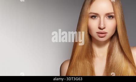 Elegant Woman Promotes Hair Products. Confident Blonde Woman With Radiant Hair Featured In Advertisement. Striking Caucasian Woman With Luminous Hair Stock Photo