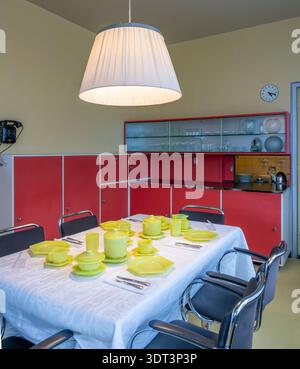 Red cupboards and serving hatch in the Dining room of Sonneveld House, Rotterdam, built early 1930s in the functionalist Nieuwe Bouwen (New Building) Stock Photo