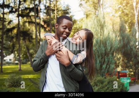 Couple Enjoys Time Together in a Park During Warm Afternoon in Spring Stock Photo