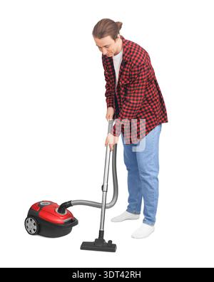 Young man in plaid shirt vacuuming floor isolated on white. Happy guy doing household chores and cleaning with red vacuum cleaner. High quality photo Stock Photo