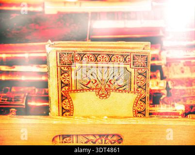 Old wisdom concept. Old books for sale at flea market in Paris (France). Toned photo. Stock Photo