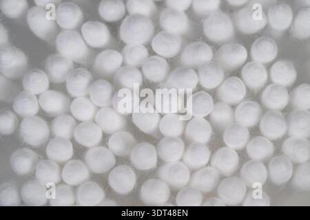 Close up cotton swabs heads arranged in sterile grid, soft fibrous tips illuminated by diffused light, clinical texture and macro detail for healthcar Stock Photo