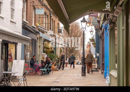Title LONDON - 15 DECEMBER 2025: Flask Walk Hampstead – Colorful Village Shops and Pedestrians on Cobbled Lane Stock Photo