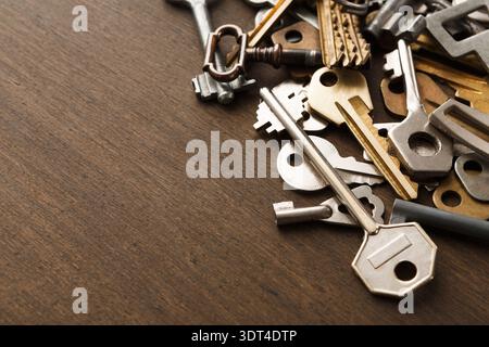 Collection of Old Keys Arranged on a Wooden Surface for Display and Exploration Stock Photo