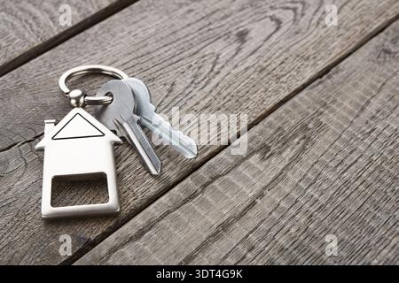 Collection of House Keys on a Wooden Table in a Home Setting During Daytime Stock Photo
