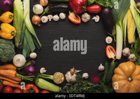 Collection of Fresh Vegetables Arranged in a Creative Collage on a Wooden Surface Stock Photo