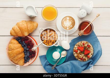 Breakfast Spread With Different Foods and Drinks on a Wooden Table Stock Photo