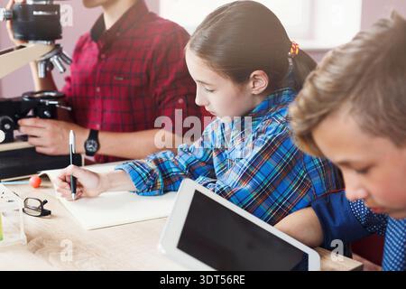 Students Engaged in Science Activities at School During the Day Stock Photo