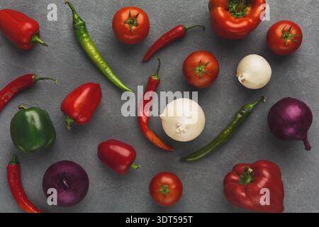 Colorful Vegetable Collage With a Variety of Fresh Produce and Spices on a Gray Background Stock Photo