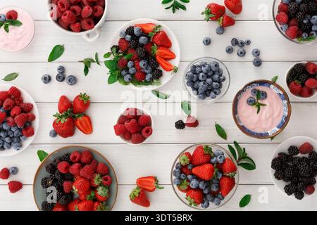 Collage of Fresh Fruits and Yogurt Arranged on Wooden Table in Colorful Collection Stock Photo