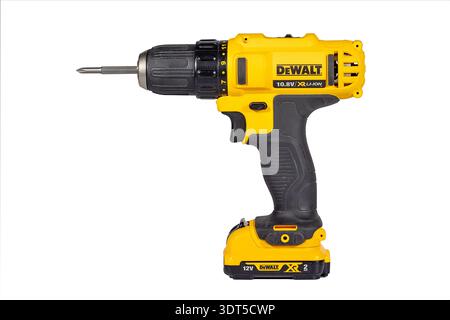 Equipped with a vibrant yellow exterior, this DeWalt cordless drill is poised for action. Perfect for DIY projects, it showcases durability and streng Stock Photo