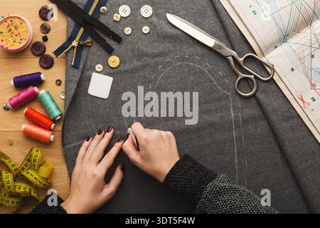 Crafting a Custom Garment With Fabric, Tools, and Colorful Threads for Sewing Projects Stock Photo