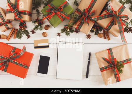 Gift Boxes and Stationery for Holiday Planning on a Wooden Table Stock Photo