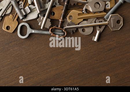 Collection of Old Keys Arranged on a Wooden Table Creating a Vintage Mosaic Look Stock Photo