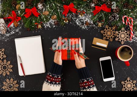 Gift Wrapping Session With Decorations and Holiday Items on a Table Top Stock Photo
