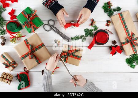Gift Wrapping Session With Friends During Holiday Time Creating Fun Memories Stock Photo