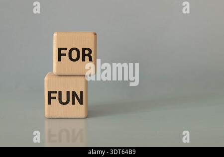 Fun word written with wooden alphabets blocks on blue chart kids children background Stock Photo