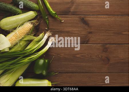 Collection of Fresh Vegetables Arranged on a Wooden Surface Stock Photo
